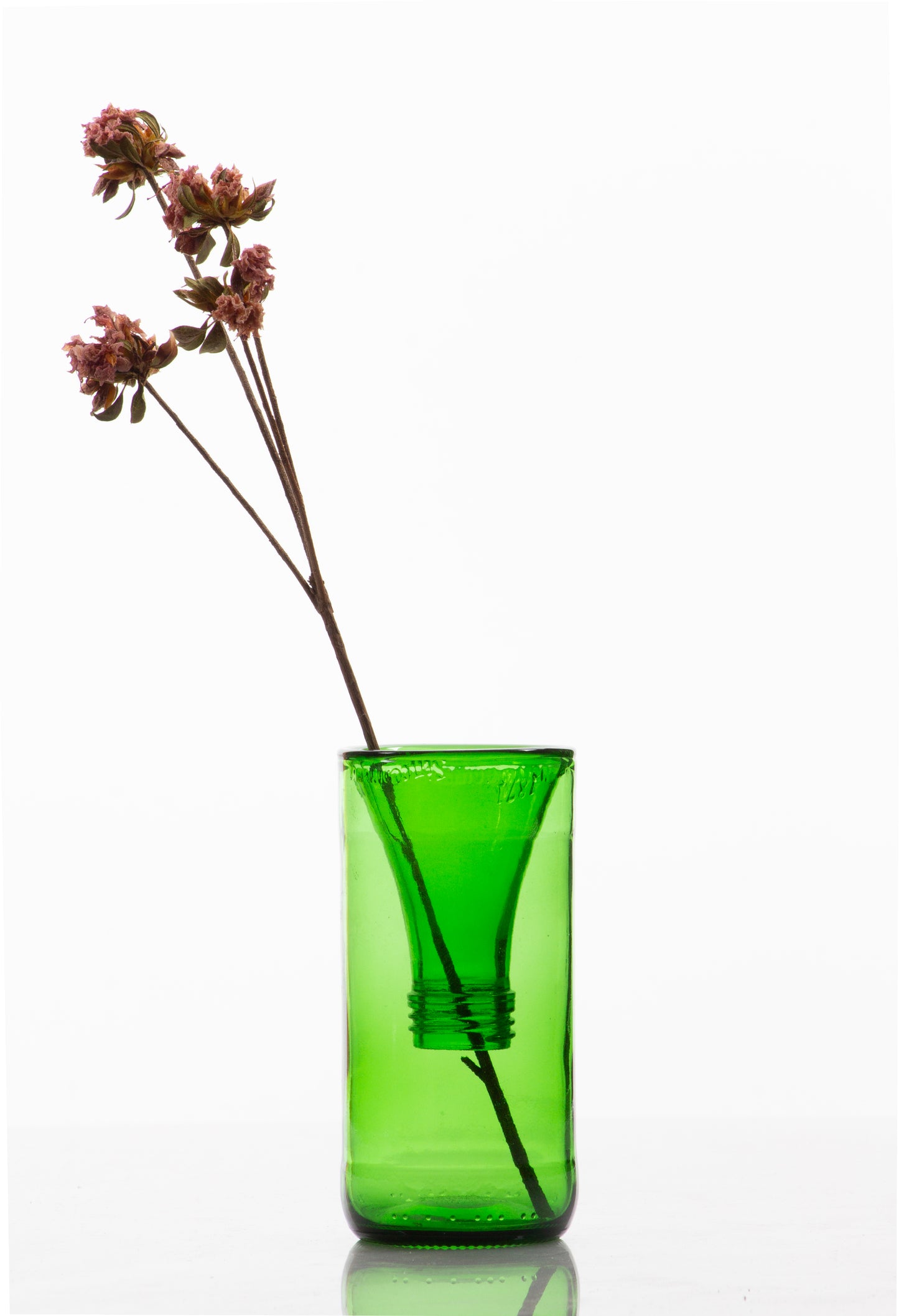 One of a kind recycled green glass vase made using scientific glassblowing Dewar seal technique, with dried stems, white background